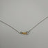 Collana Croce Oro bianco 18k Diamanti 0,07 Smeraldi 0,18 | Gioiellitosti.it
